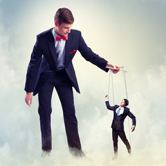 Businessman puppeteer