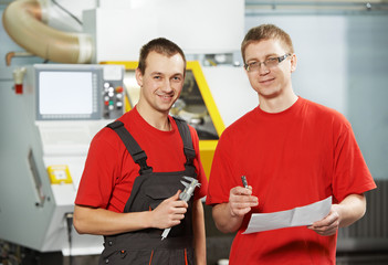 industrial workers at tool workshop