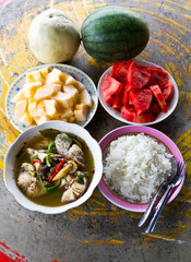 Fish soup with cantaloupe and watermelon on the table concrete
