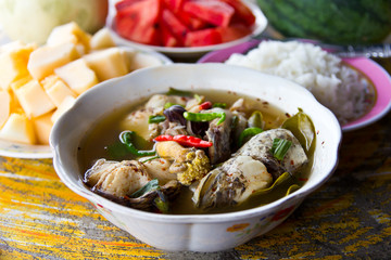 Fried fish with steamed rice and fruits
