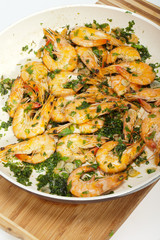 Fried shrimps with the garlic and the parsley