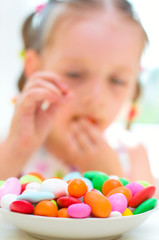 girl eating candies