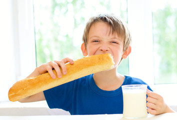 boy with milk and long loaf