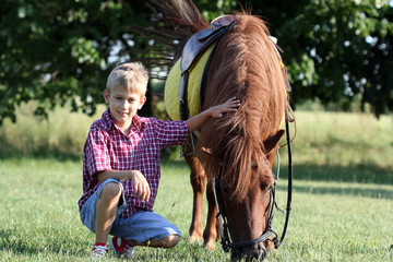 happy boy and pony horse