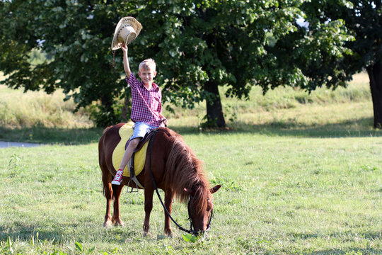 Happy Boy Riding Pony Horse