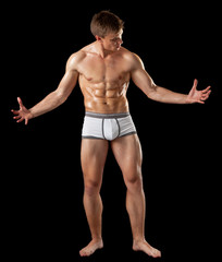 Fototapeta na wymiar young bodybuilder demonstrates posture