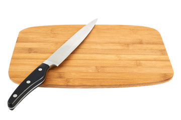 Knife over wooden cutting board