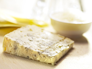 blue cheese served on a wooden board