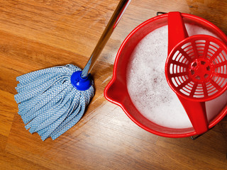 mop and bucket with water for cleaning floors