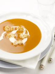 lobster soup with prawns and cream in it