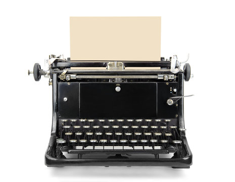 Typewriter with blank sheet isolated on white.