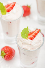 Eton Mess Shots - Strawberries with whipped cream and meringue.