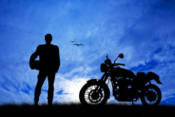 Fototapeta na wymiar motorcyclist at sunset
