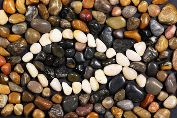 Fish - Christian symbol. White and dark stones