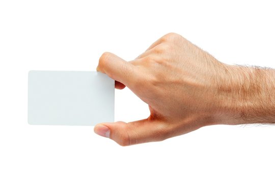 Plastic card in man hand. Studio isolated