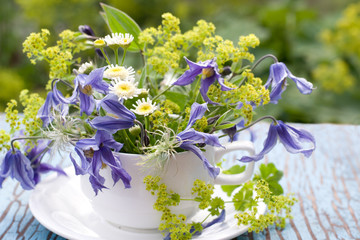 Bouquet of clematis and alchemilla