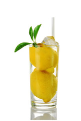 Glass of water with whole lemons