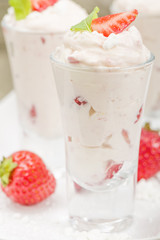 Eton Mess Shots - Strawberries with whipped cream and meringue.
