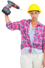 Blonde handy woman holding a power drill