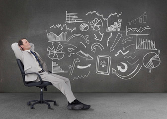 Businessman resting on a chair