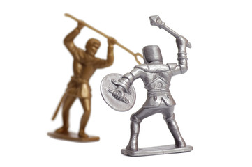 Fighting toy soldiers on a white background, knights