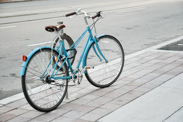 Women's bicycle parked on the street