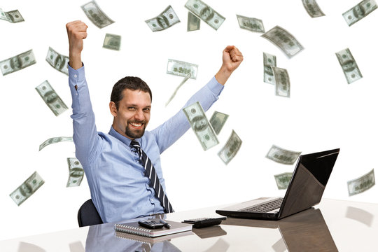 businessman with his hands raised with money rain