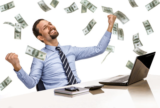young modern businessman excited with success with money rain