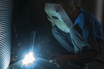 Sparks coming out of welding torch - obrazy, fototapety, plakaty