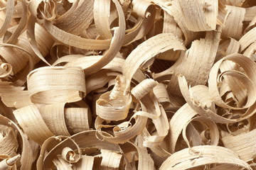 Wooden shavings in workshop on planks