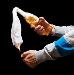 man with lighter ignite molotov cocktail