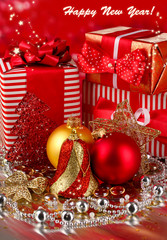 Christmas decoration and gifts on red background