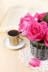 Beautiful pink roses in vase on wooden table close-up