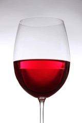 Glass of wine on gray background