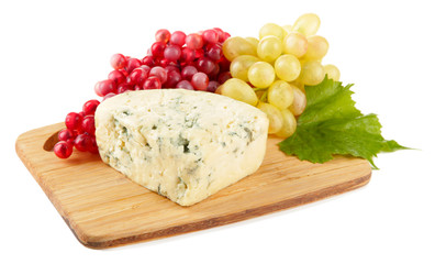 Tasty blue cheese and grape on cutting board, isolated on white