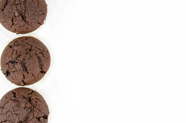 Chocolate muffins isolated on white