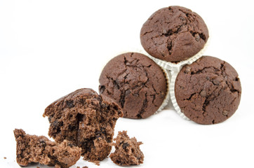 Chocolate muffin with crumbs, isolated on white