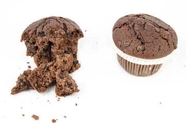 Chocolate muffin with crumbs, isolated on white