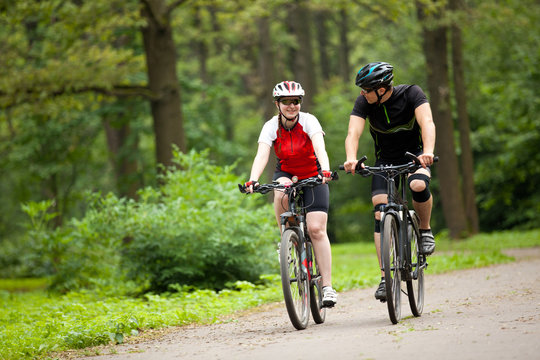 Man and woman riding bicycles