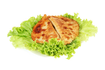 Tasty chebureks with fresh herbs on plate, close-up