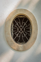An old oval-shaped window