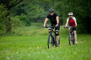 Man and woman riding bicycles