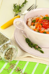 Delicious rice with vegetables and herbs in pot