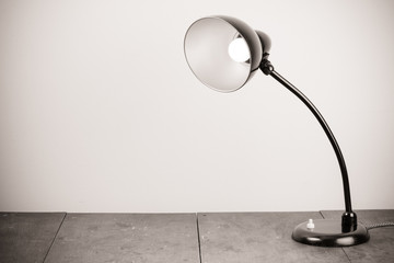 Black retro desk lamp with lighting bulb