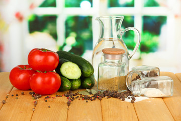 Tasty  fresh and canned cucumbers and red tomatoes,