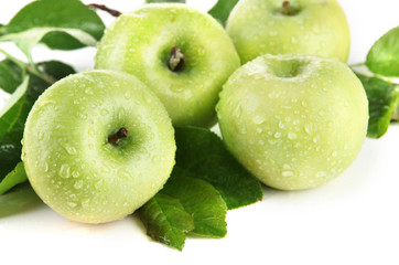 Juicy green apples with leaves, isolated on white