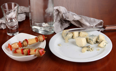 Vodka and snack on table close-up