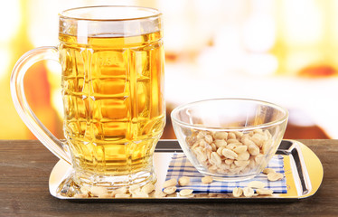 Beer in glass and nuts