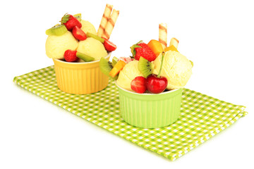 Delicious  ice cream with fruits and berries in bowl isolated