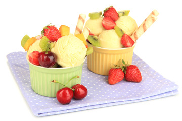 Delicious  ice cream with fruits and berries in bowl isolated